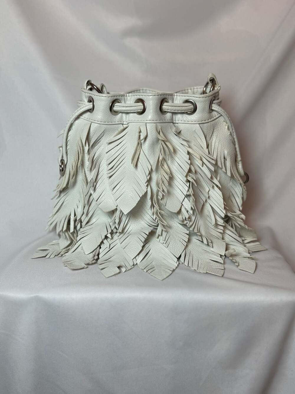 CHI by Carlos Falchi "Leaves" bucket handbag is made of genuine, high-quality le